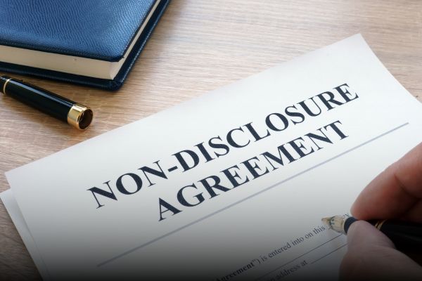 Business professionals reviewing a Non-Disclosure Agreement